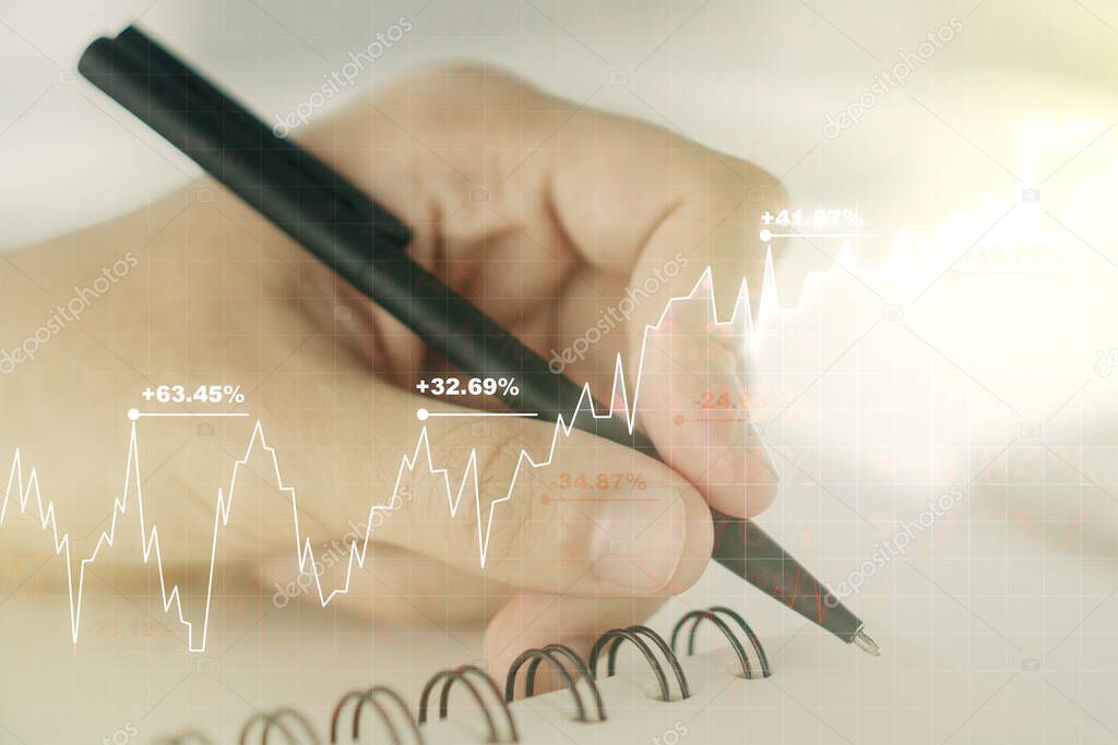 Double exposure of abstract creative financial chart with hand writing in notebook on background, research and strategy concept