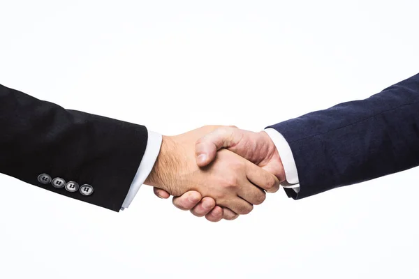 Twee zakenmannen schudden handen op een witte muur achtergrond, deal concept, close-up — Stockfoto