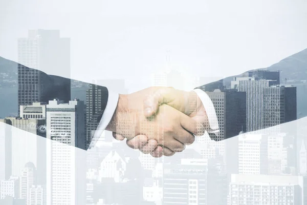 Multi exposure of handshake of two businessmen on city skyscrapers background, collaboration and teamwork concept — Stock Photo, Image