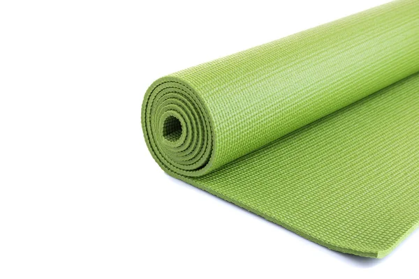 Yeni yeşil yumuşak Yoga mat. Stüdyo izole üzerinde beyaz arka plan vurdu