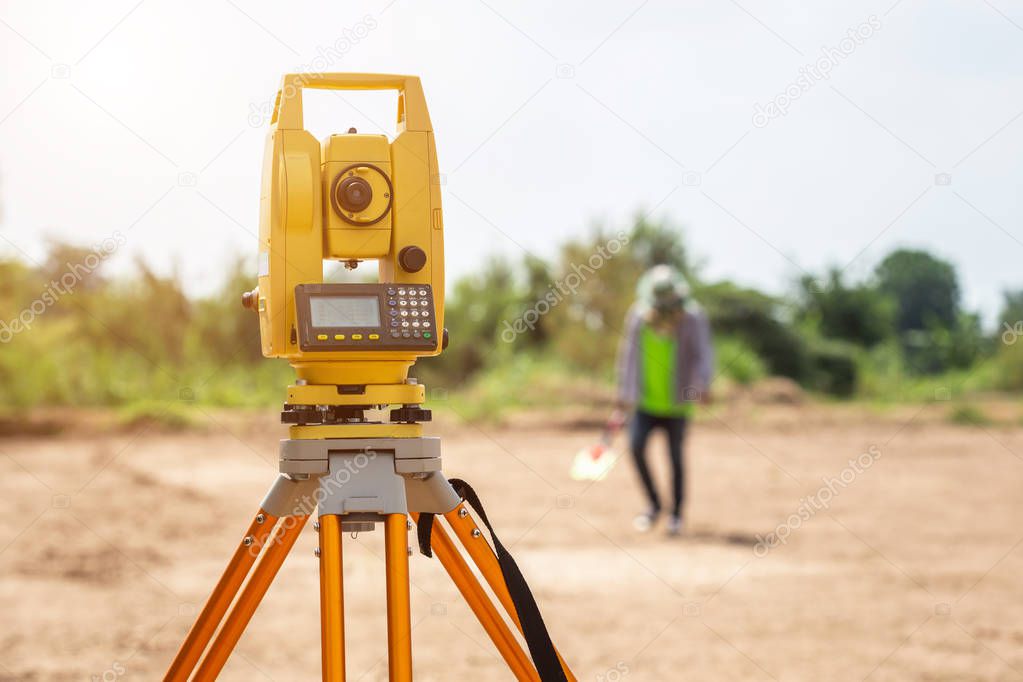 Land checking : Surveyor engineer making measure at the land
