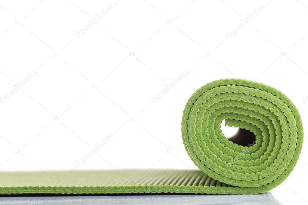 New green soft Yoga mat. Studio shot isolated on white background