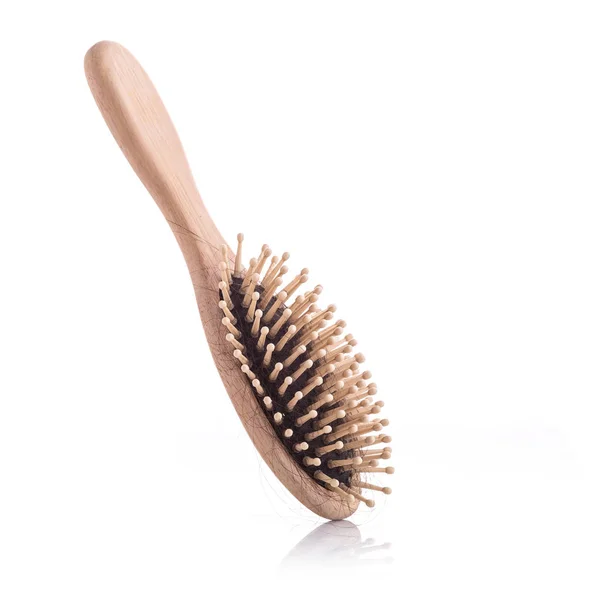 Wooden comb with black hair loss problem studio shot and isolate — Stock Photo, Image