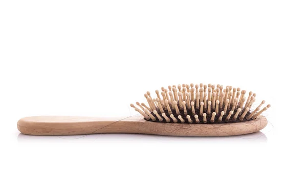 Wooden comb with black hair loss problem studio shot and isolate — Stock Photo, Image