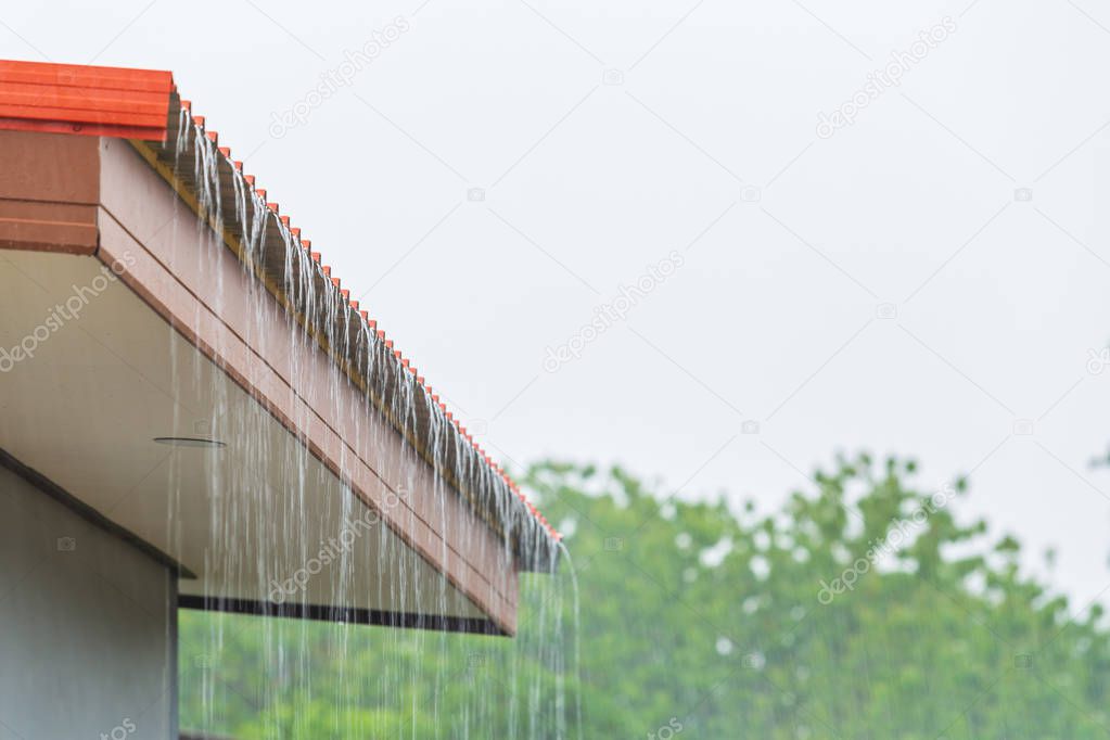 Rain flowing down from the roof house