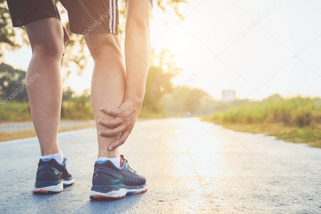 Injury from workout concept : Asian man use hands hold on his an