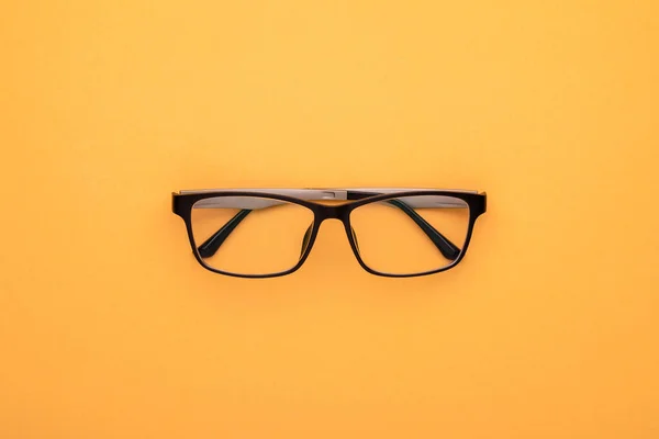 Top View New Eyeglasses Yellow Background Copy Space Text Design — Stock Photo, Image