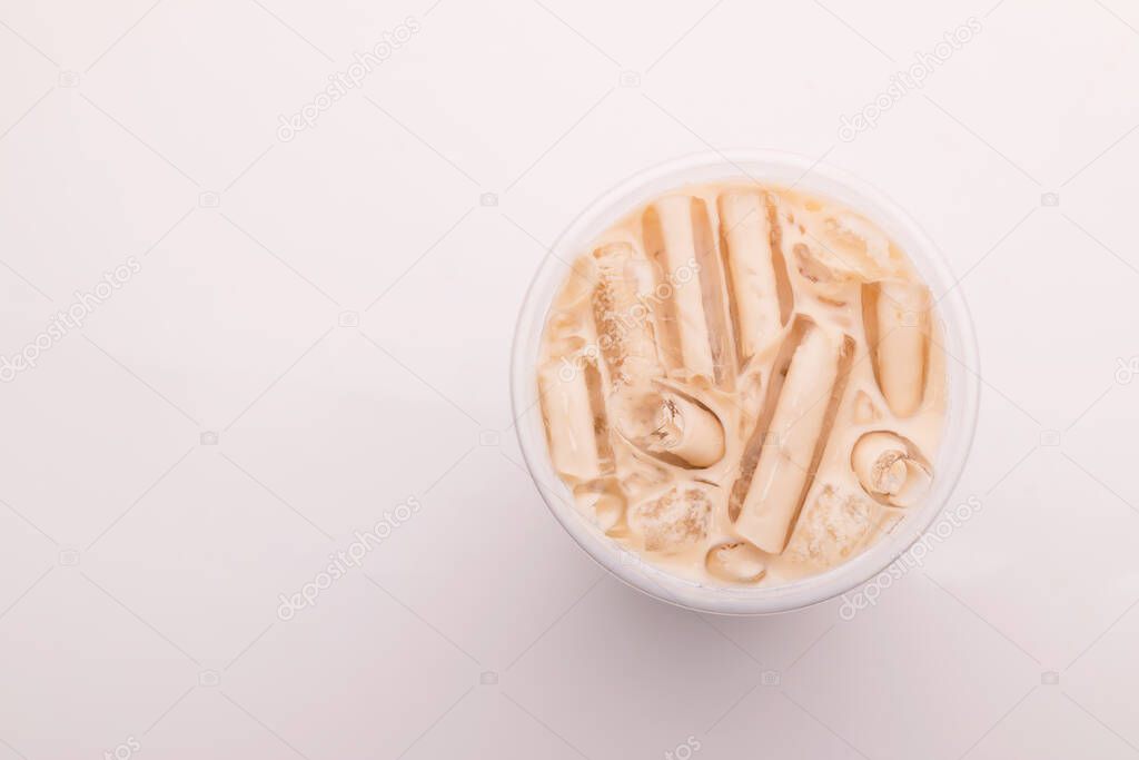 Top view bubble milk tea with ice in plastic glass on white background