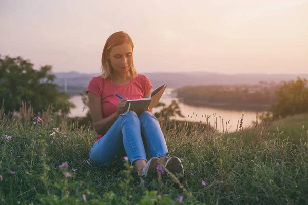 Beautiful Woman Enjoys Writing Outdoor Cityscape River View Her Image — стоковое фото