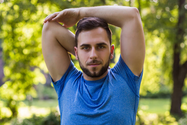 Handsome man exercising in the park.