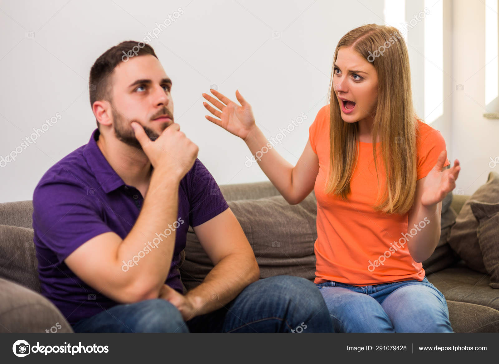 Angry Wife Husband Having Conflict While Sitting Sofa Home Stock Photo by  ©inesbazdar 291079428
