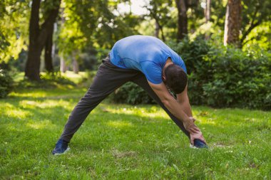 Handsome man practicing  in the park.