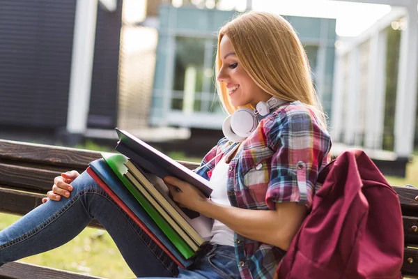 Female Student Reading Book While Spending Time Outdoor — Stock Photo, Image