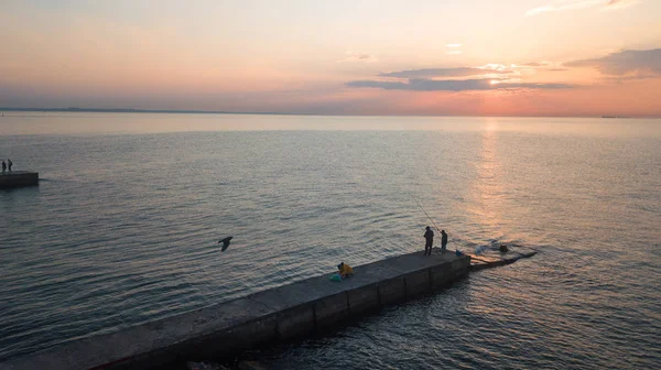 Fishermen catch fish at dawn. Photographed from the drone. Aerial photo shooting. — Stock Photo, Image