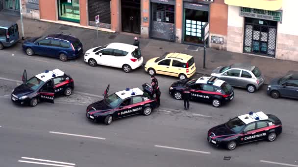 ROME, ITALY - MARCH 20, 2020: Four police officers cars patrolling on the road in the city centre of Rome, traffic on the street in peak time, italian surveillance system — Stock Video