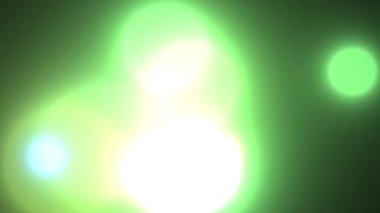 Yumuşak yeşil bir video. Bulanık, dairesel ışık demetleri projeleriniz ve çalışmalarınız için hoş, hafif bir zemin oluşturur.