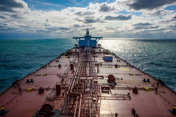 Taanker proceeding by ocean. Captured from forward mast.