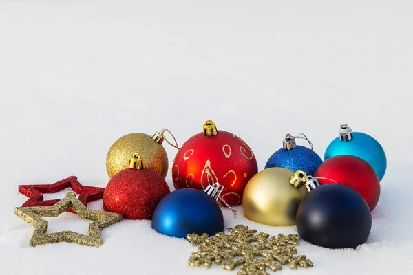 Multicolored Christmas Decorations Lie Snow — Stock Photo, Image