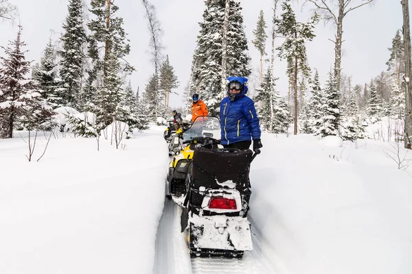 Athletes on a snowmobiles. — Stock Photo, Image