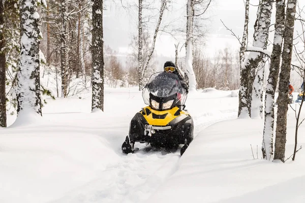 Athlete on a snowmobile. — Stock Photo, Image