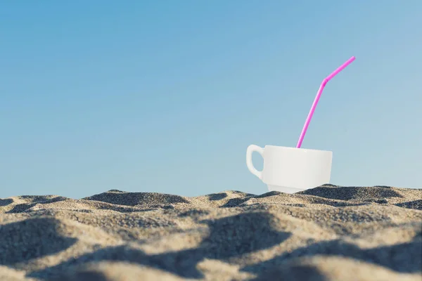 cup of coffee in the sand at sunrise near the sea. Concept