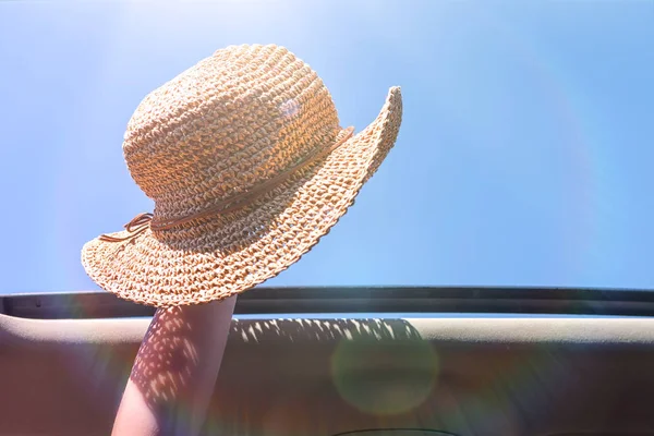 Girl Trowing Away Her Straw Hat Out Open Hatch Vehicle — Stock Photo, Image