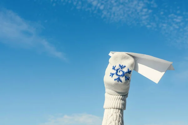 Girl Winter Knitted Mittens Launching Paper Airplane Blue Sky Background — Stock Photo, Image