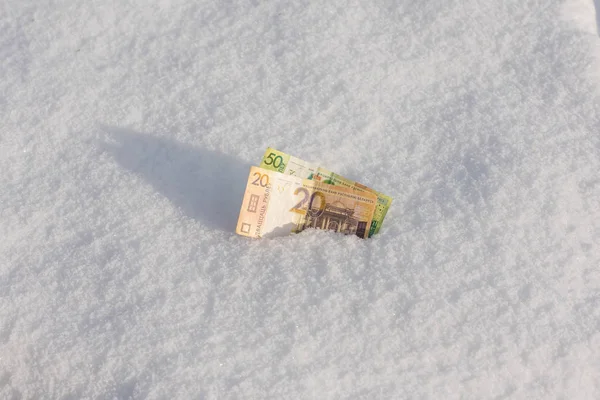 Banknotes of the Belarusian rubles samples withdrawn from circulation in the snow