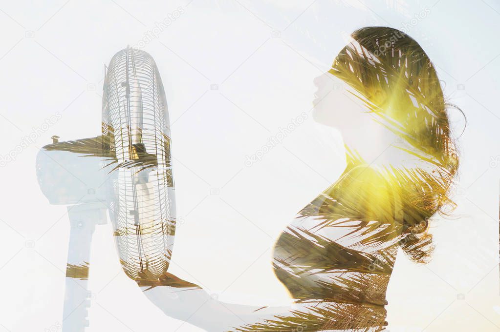 Double exposure of a girl body with a fan and palm tree.  