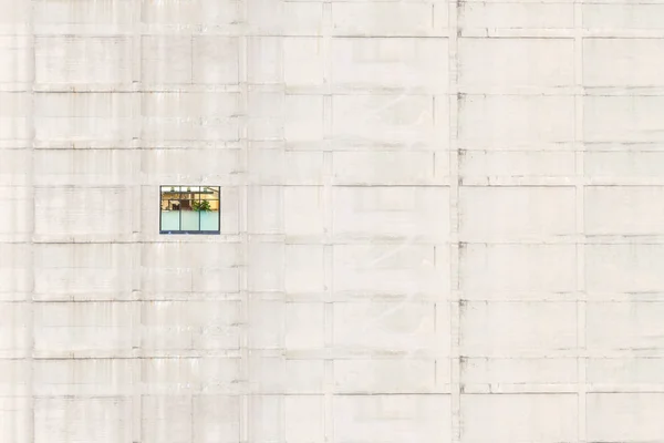 Creative picture of one office window on the concrete building. Concept.