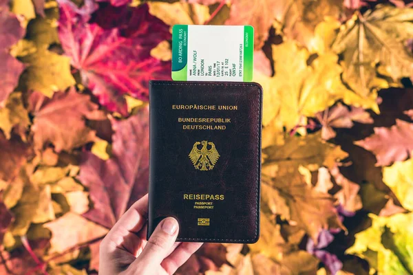 German Passport Boarding Pass Woman Hand Maple Leaves Background Autumn — Stock Photo, Image