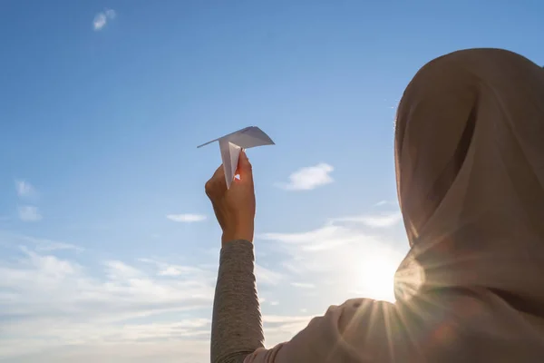 Silhouette Muslim Woman Head Scarf Launching Paper Airplane Blue Sunset — Stock Photo, Image