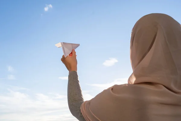 Silhouette Muslim Woman Head Scarf Launching Paper Airplane Blue Sunset — Stock Photo, Image