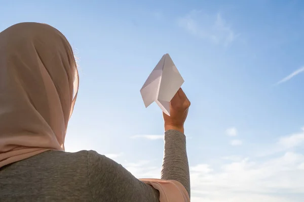 Silhouette Muslim Woman Head Scarf Launching Paper Airplane Blue Sunset — Stock Photo, Image