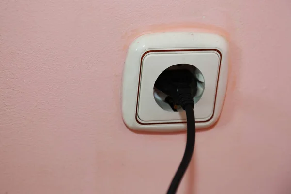 Black Wire Inserted Socket Pink Wall Cable Connected Wall Socket — Stock Photo, Image