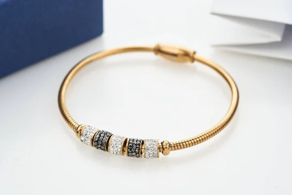 Beautiful golden bracelet with crystals isolated on white