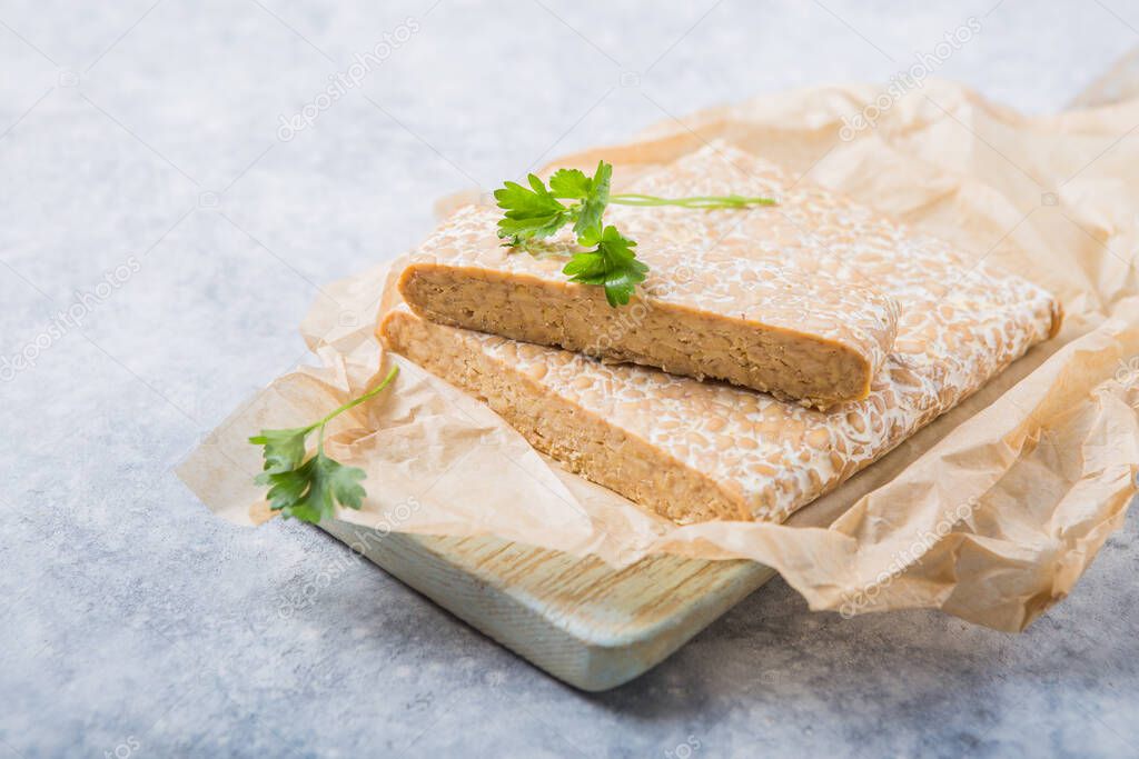 Slice of tempeh  or tempe made of fermentation process that binds soybeans, is traditional food from Indonesia and Malaysia