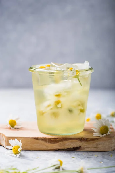 Boozy Long Island Iced Tea with chamomile flowers