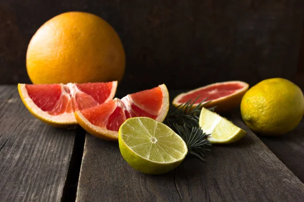 close up of citrus fruits on black background