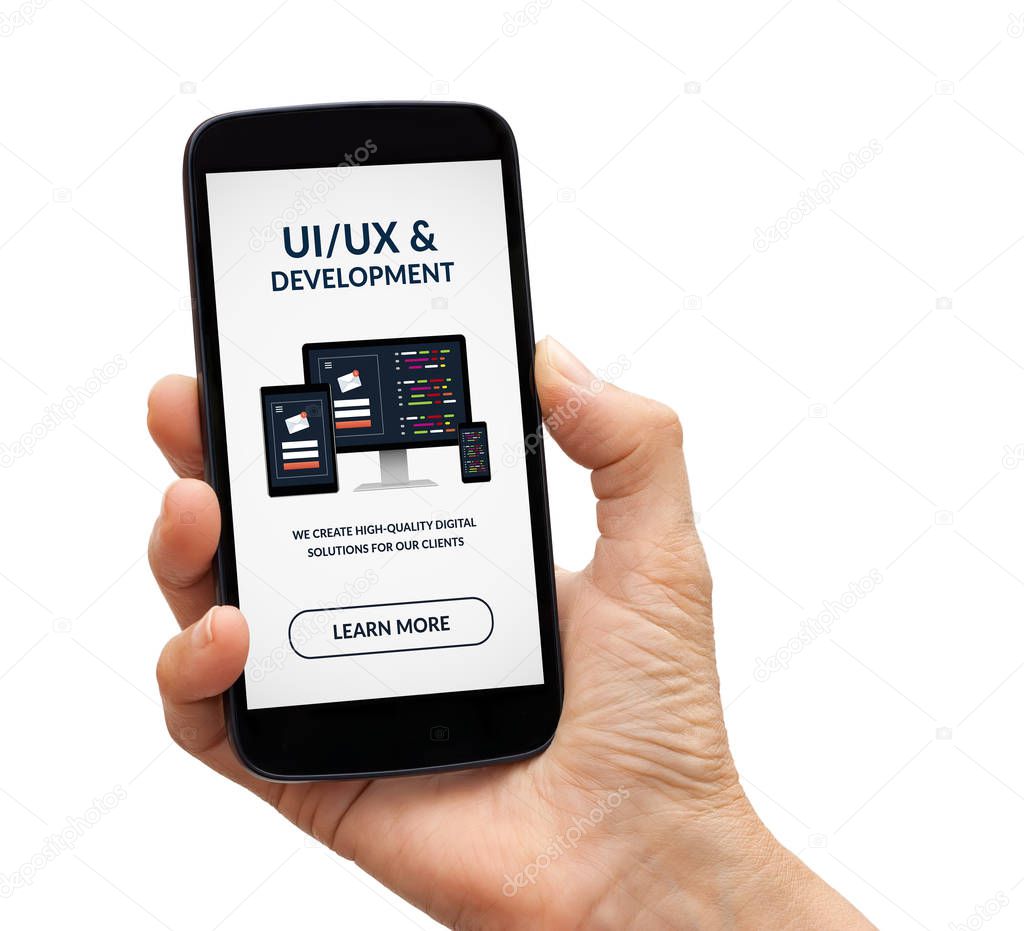 Hand holding smart phone with UI/UX design and development concept