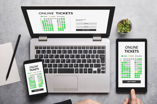 Online tickets concept on laptop, tablet and smartphone screen