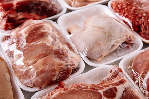 Raw meat in foam packaging trays