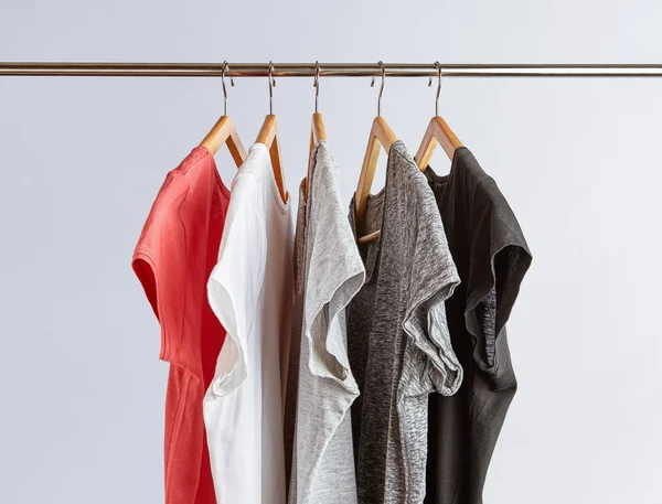 T-Shirts in neutral colors on rack — Stock Photo, Image