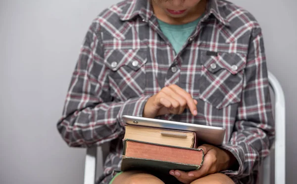 Boy Holds Books Tablet Focus Book Hand — Stock Photo, Image