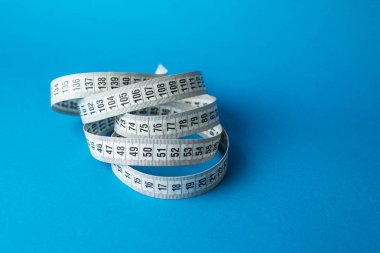 Terzi teyp arka plan üzerinde ölçüm yukarı kapatın. Alan sığ bölümü beyaz ölçme bant.