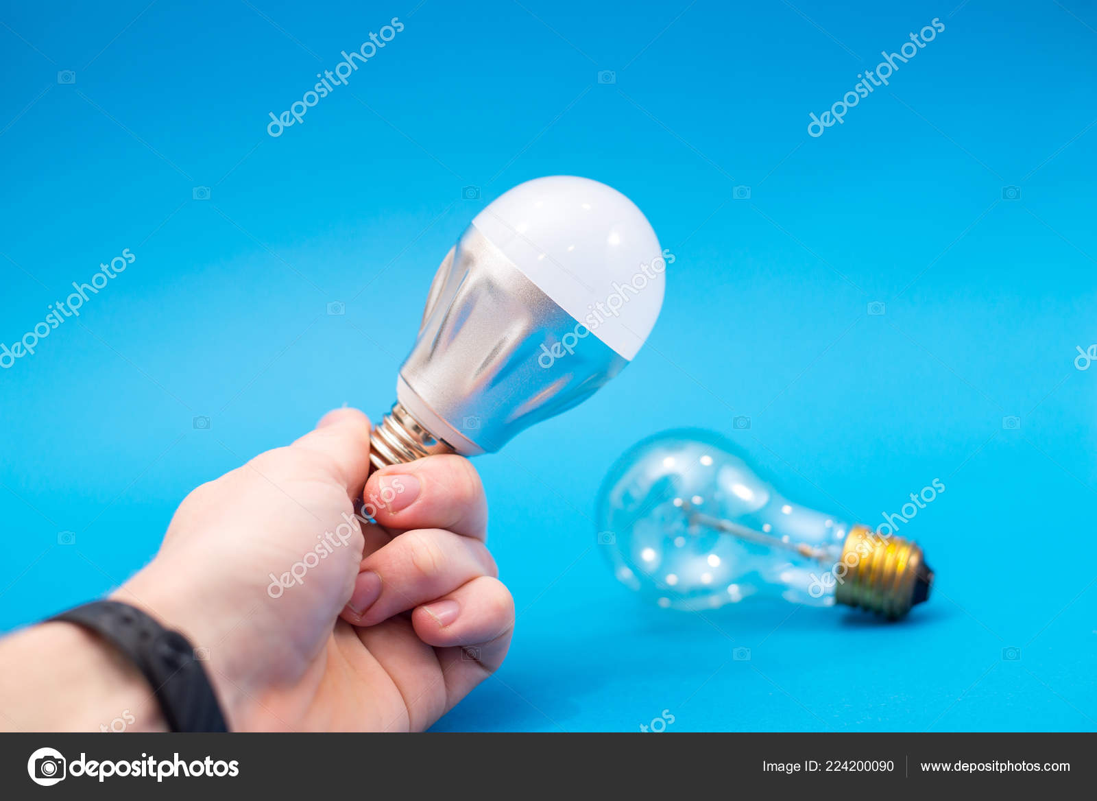 Incandescent Light Bulb Led Lamp Being Compared Stock Photo by