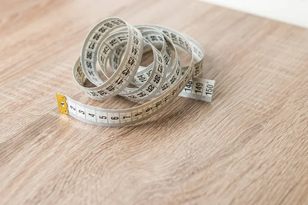 Terzi teyp arka plan üzerinde ölçüm yukarı kapatın. Alan sığ bölümü beyaz ölçme bant.