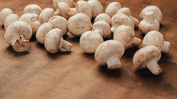 Top view of mushrooms on wooden table. Copy space.