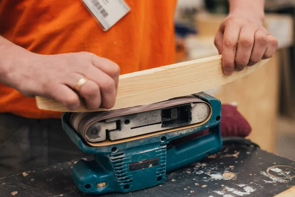 Man sanding a wood with sander in a workshop — Stock Image Man Sanding Wood Sander Workshop Royalty Free Stock Photos