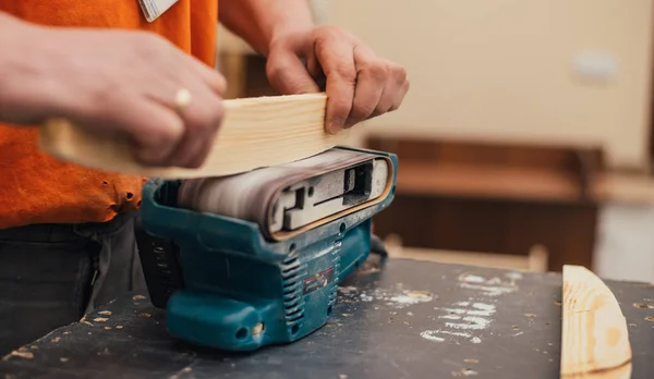 Man sanding a wood with sander in a workshop — Stock Image Man Sanding Wood Sander Workshop Royalty Free Stock Photos